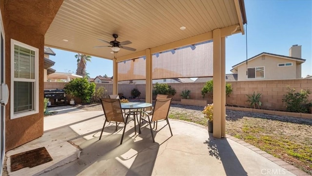 view of patio featuring ceiling fan