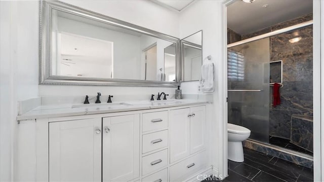 bathroom featuring toilet, walk in shower, and vanity