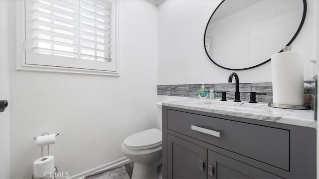 bathroom with toilet and vanity