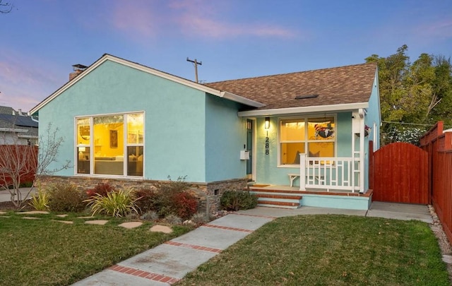 bungalow-style home featuring a lawn