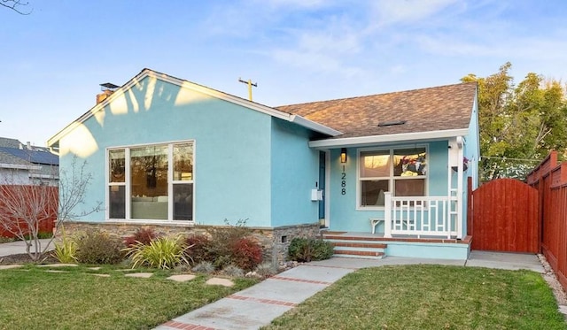 bungalow-style house featuring a front yard