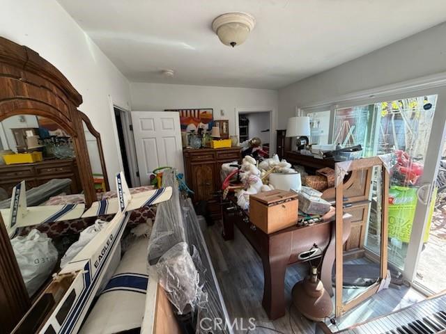 misc room with dark wood-type flooring