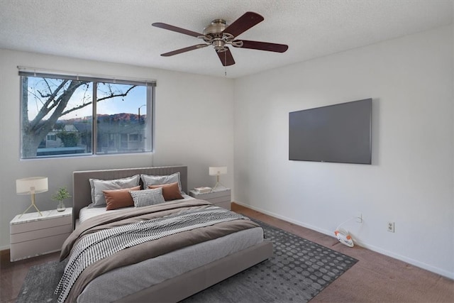 bedroom featuring a textured ceiling and ceiling fan