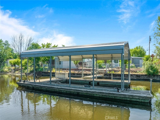 dock area with a water view