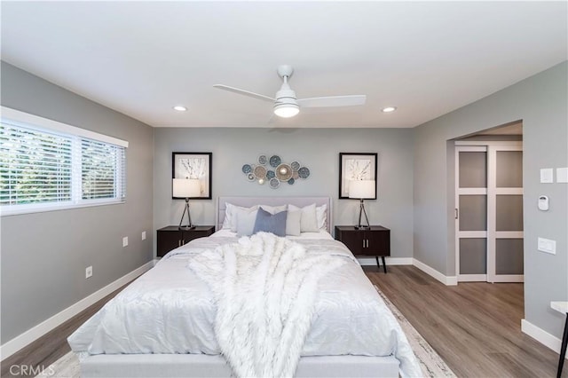 bedroom featuring hardwood / wood-style flooring and ceiling fan