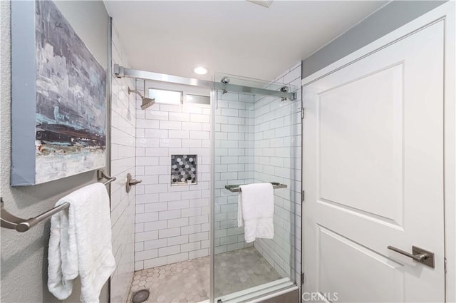 bathroom featuring an enclosed shower