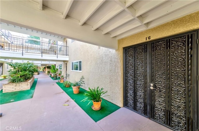 doorway to property with a patio