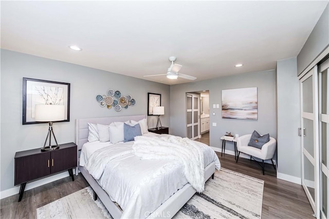 bedroom with ceiling fan and dark hardwood / wood-style flooring