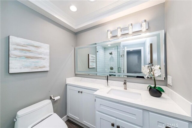 bathroom featuring toilet, an enclosed shower, vanity, and crown molding