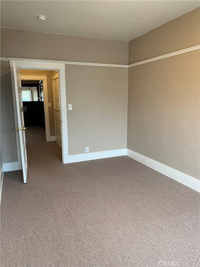 unfurnished room with carpet flooring