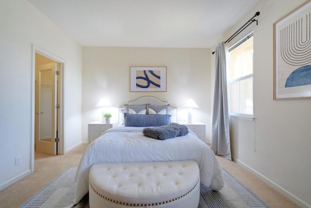 carpeted bedroom featuring multiple windows