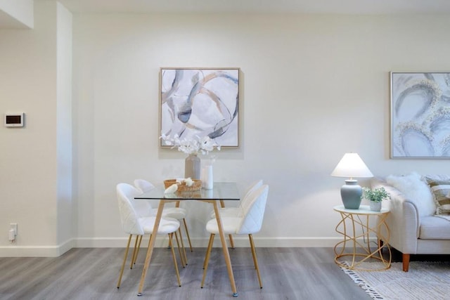 dining area with wood-type flooring