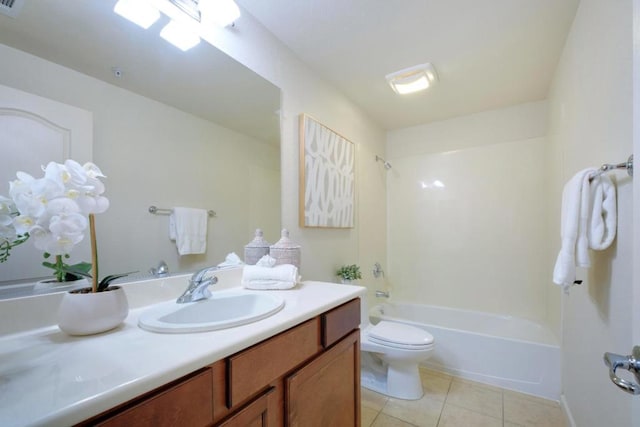 full bathroom with toilet, tile patterned flooring, shower / washtub combination, and vanity