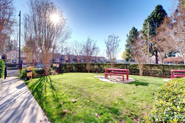 view of community featuring a patio area and a yard