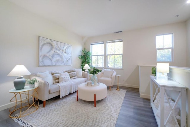 living room with dark hardwood / wood-style flooring