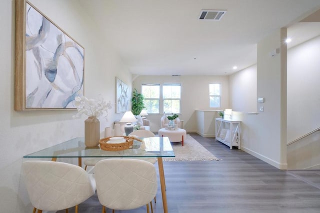 dining area with dark hardwood / wood-style floors