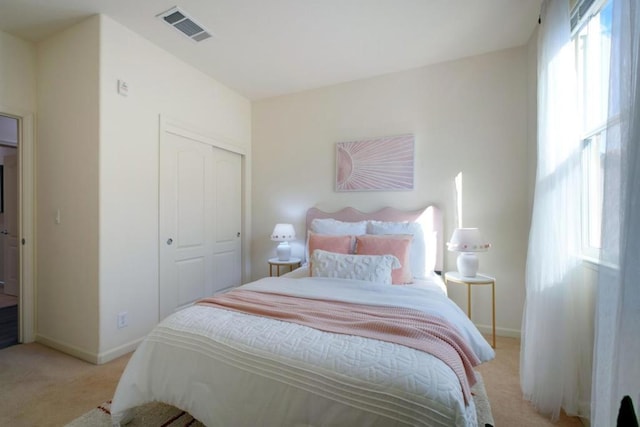 carpeted bedroom with a closet