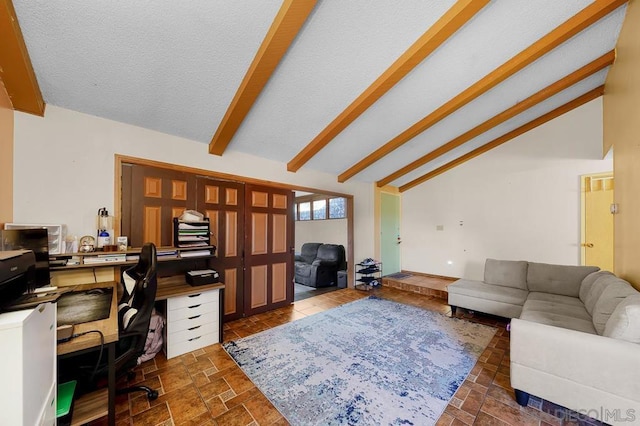 office area featuring a textured ceiling, high vaulted ceiling, and beamed ceiling