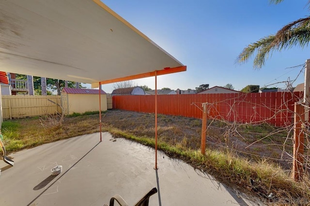 view of patio with a storage unit