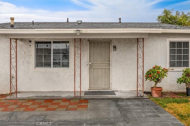 entrance to property with a patio