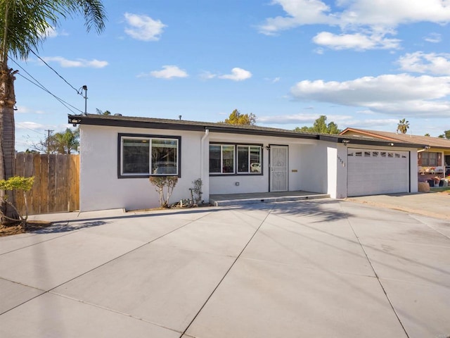 single story home featuring a garage