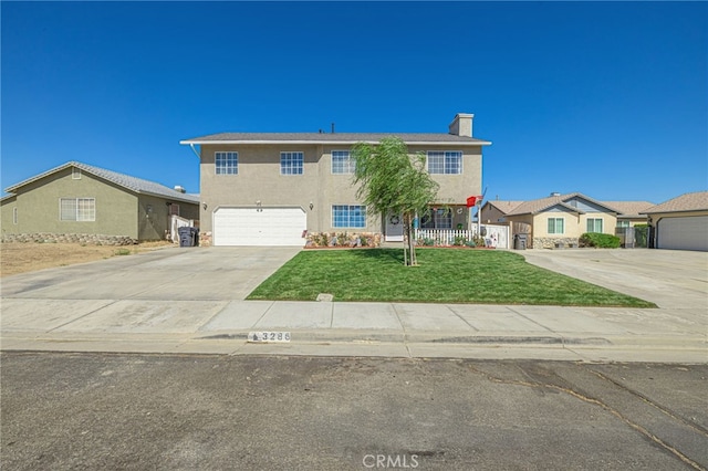 view of front of home featuring a garage and a front yard