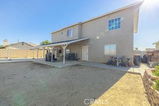 back of property with a patio area