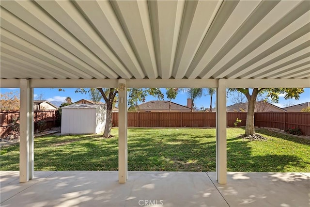 view of patio featuring a storage shed