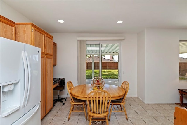 dining area with light tile patterned flooring