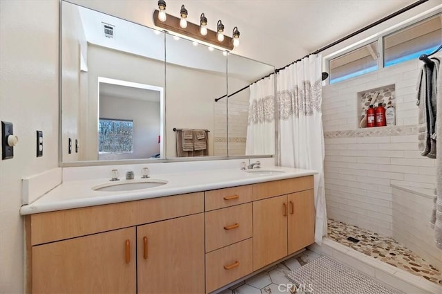 bathroom featuring a shower with curtain and vanity