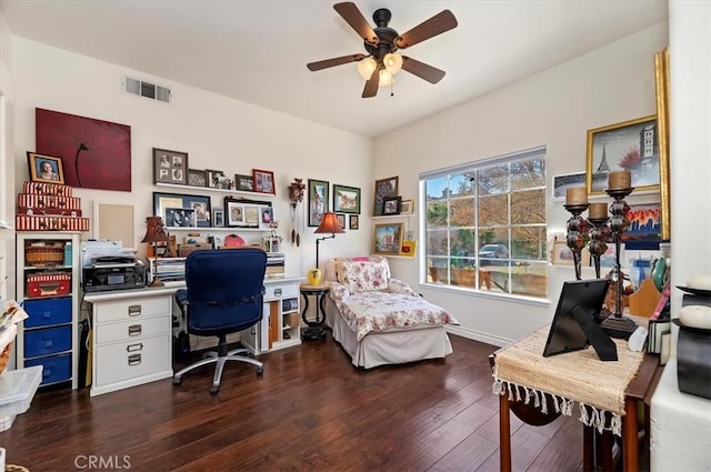 home office with ceiling fan and dark hardwood / wood-style floors