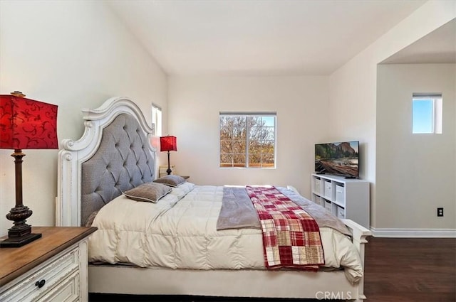 bedroom with dark wood-type flooring