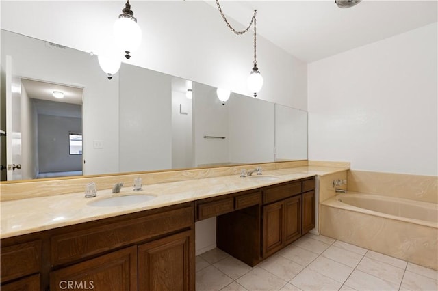 bathroom featuring vanity, a bath, and tile patterned floors