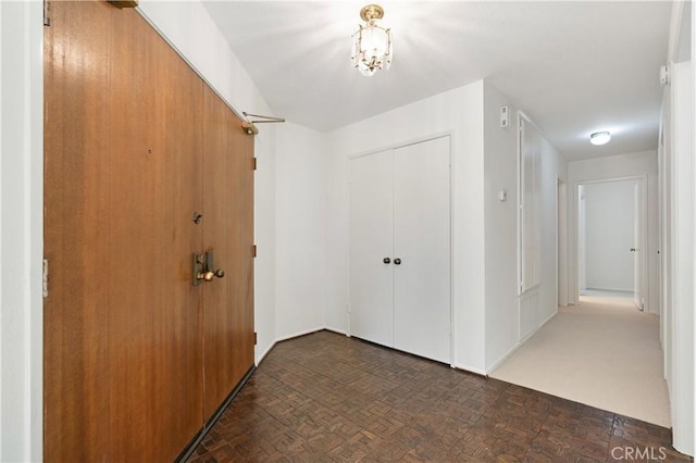 hallway featuring dark parquet floors