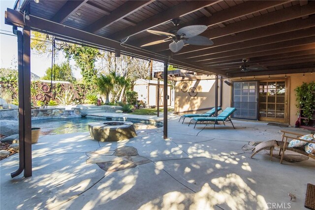 view of patio / terrace with a pool with hot tub and ceiling fan