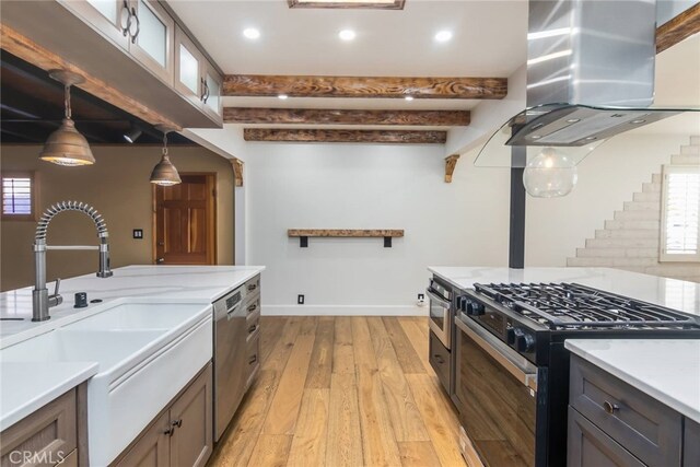 kitchen with decorative light fixtures, dishwasher, beamed ceiling, black gas range oven, and island range hood