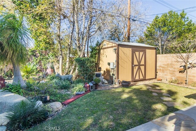 view of outbuilding with a yard