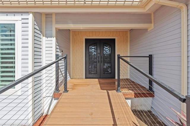 entrance to property featuring french doors