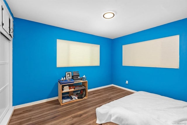 bedroom featuring dark hardwood / wood-style floors