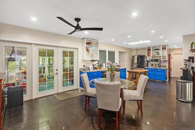 dining space with ceiling fan and french doors