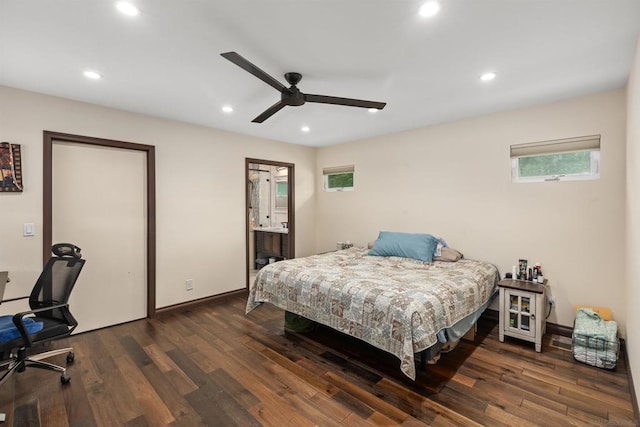 bedroom featuring ensuite bathroom, ceiling fan, and dark wood-type flooring