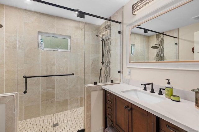 bathroom with vanity and walk in shower