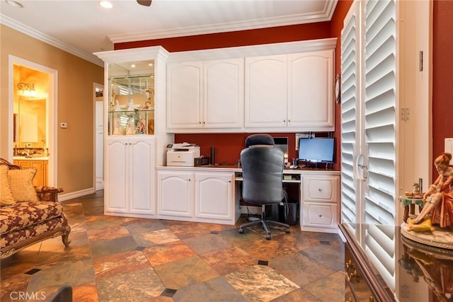 office space with crown molding and built in desk