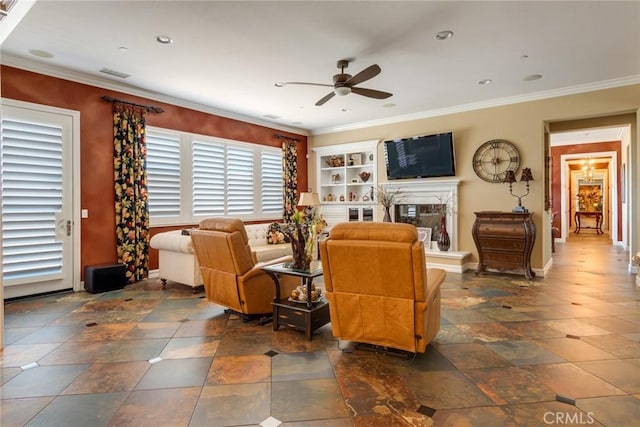 living room with crown molding and ceiling fan