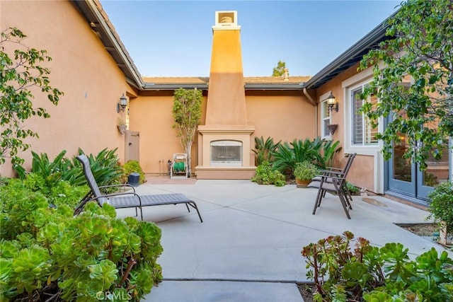 650 Crystal Mountain Cir, Riverside, CA 92506 - view of patio / terrace featuring a large fireplace