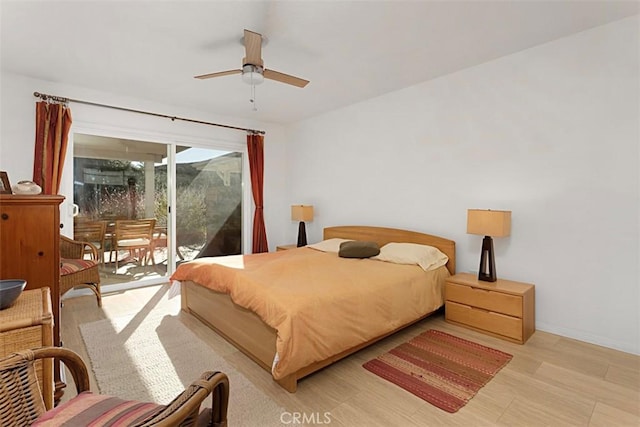 bedroom featuring ceiling fan, access to exterior, and light hardwood / wood-style flooring