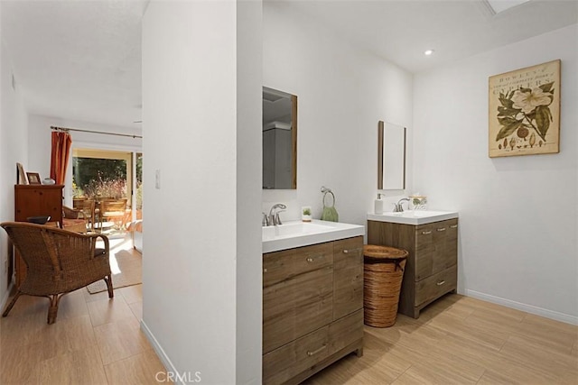 bathroom with wood-type flooring and vanity