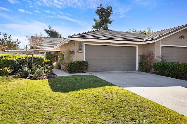 single story home with a front yard and a garage