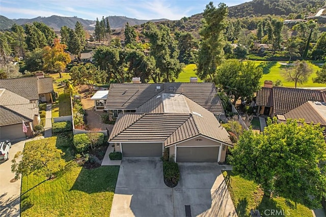 birds eye view of property with a mountain view