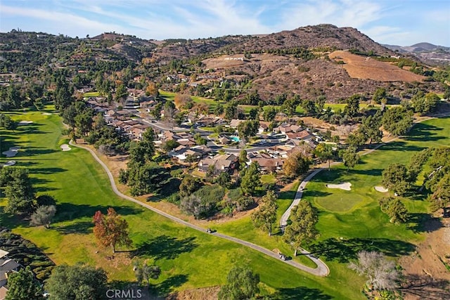 birds eye view of property featuring a mountain view